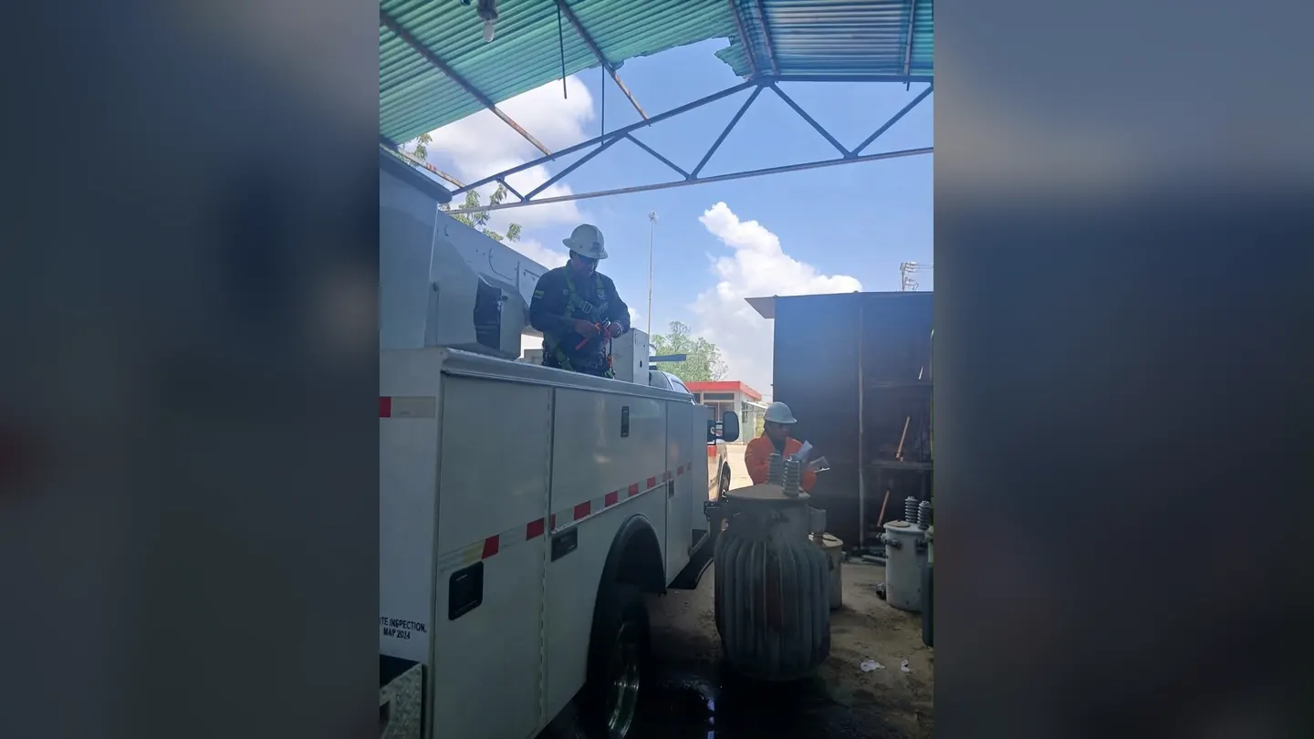 Worker on an electrical service truck