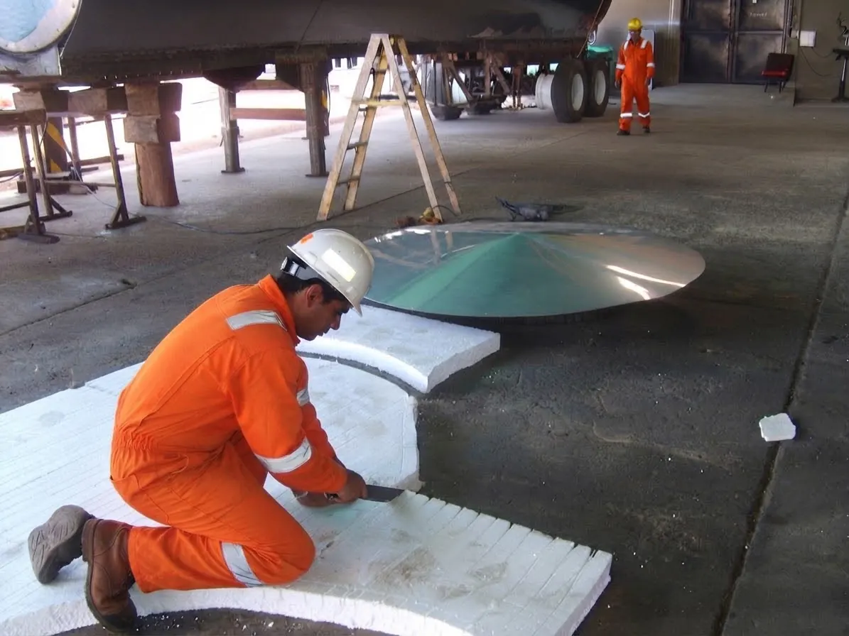 Worker cutting steel sheet in the workshop