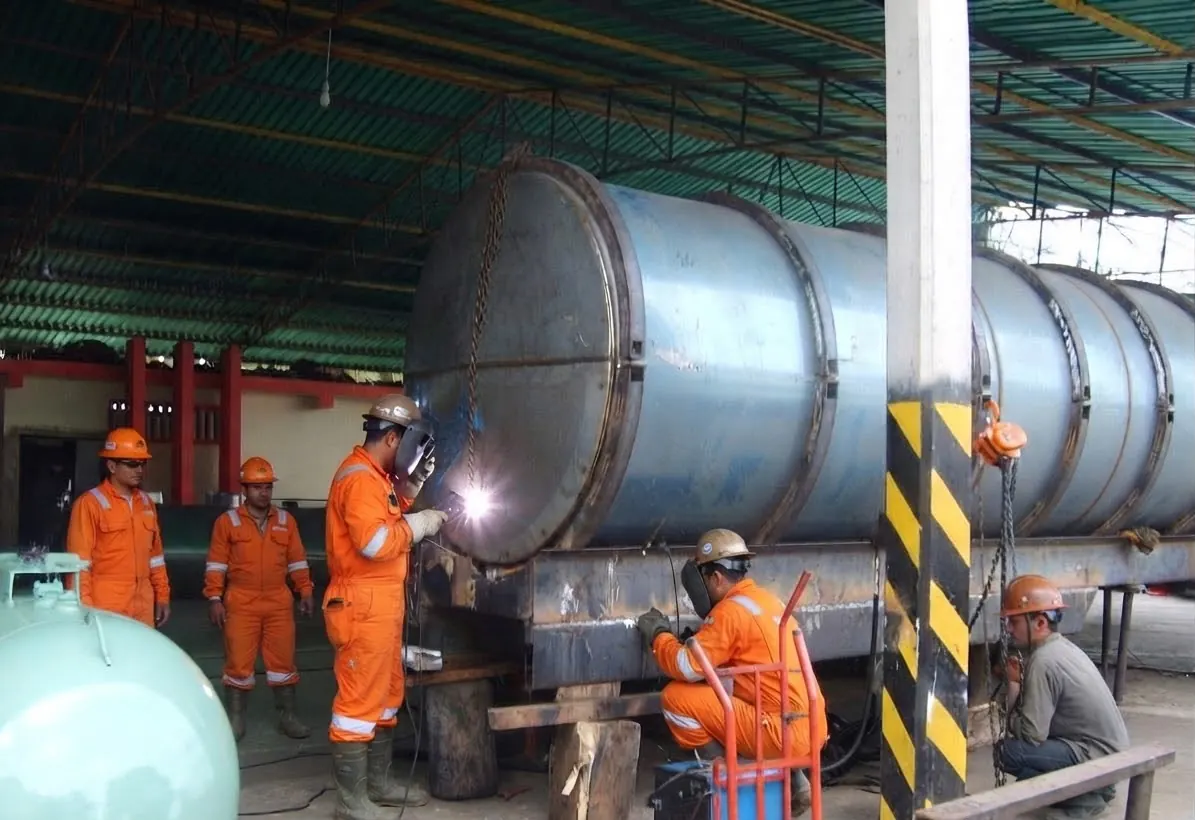 Crew welding a tanker in the workshop