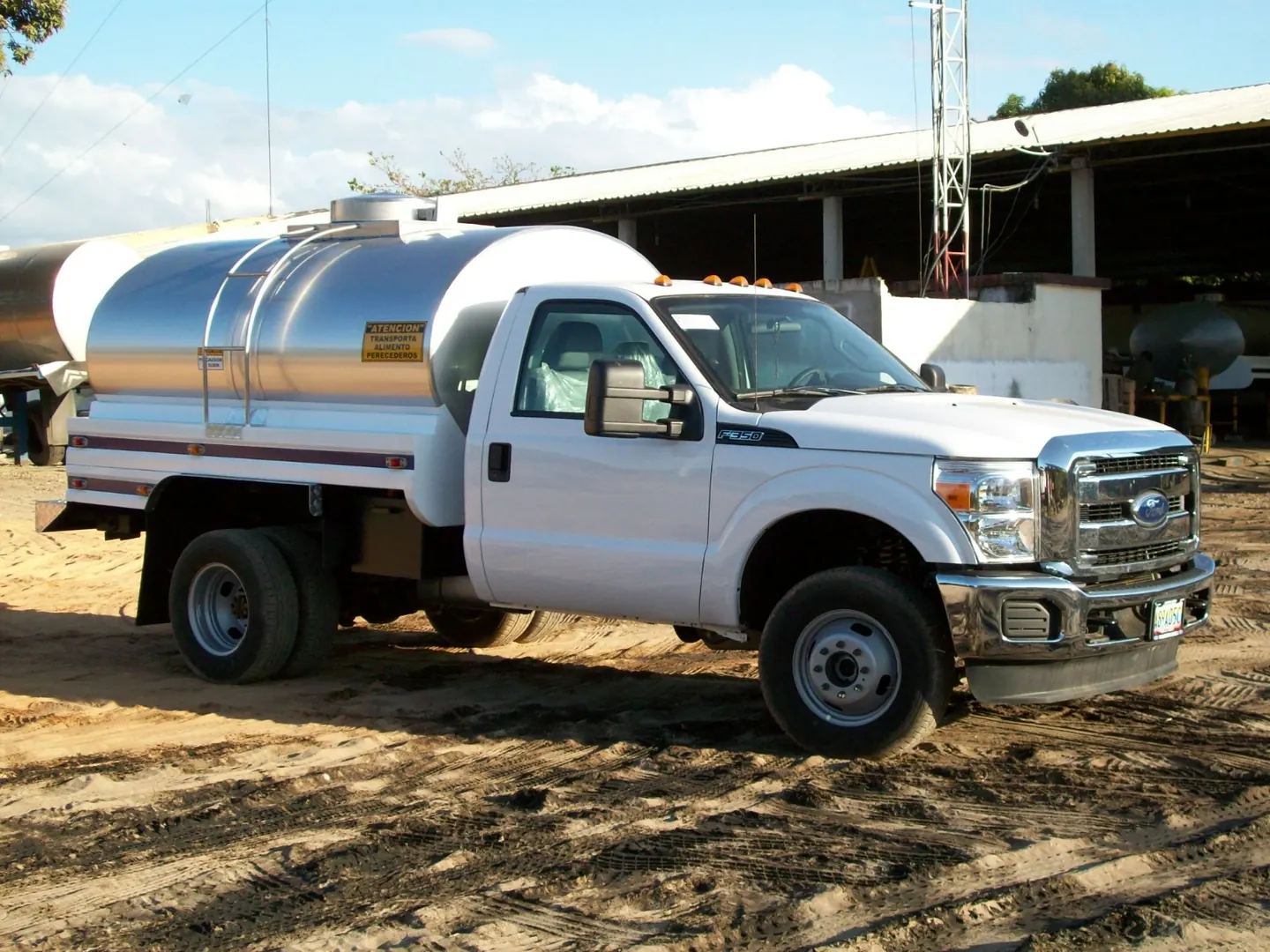 Front view of a stainless steel tanker truck