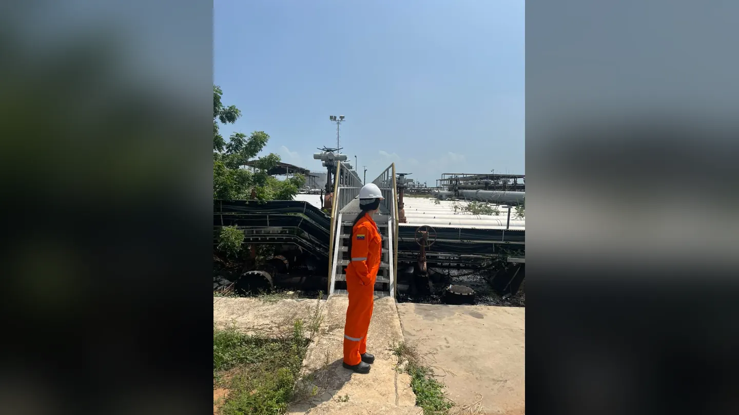 PPD technician on a walkway at the industrial facility