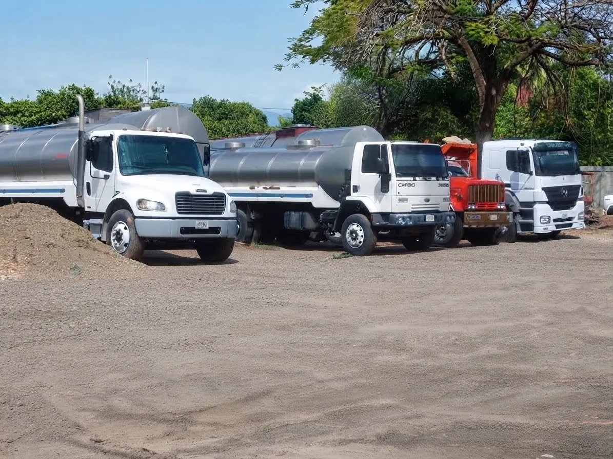 Heavy-duty tanker trucks at the base